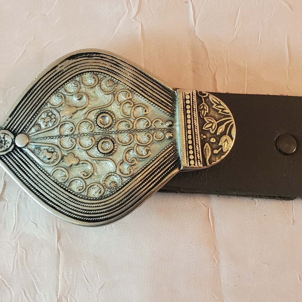 Black leather belt w/ ornate oval silver buckle